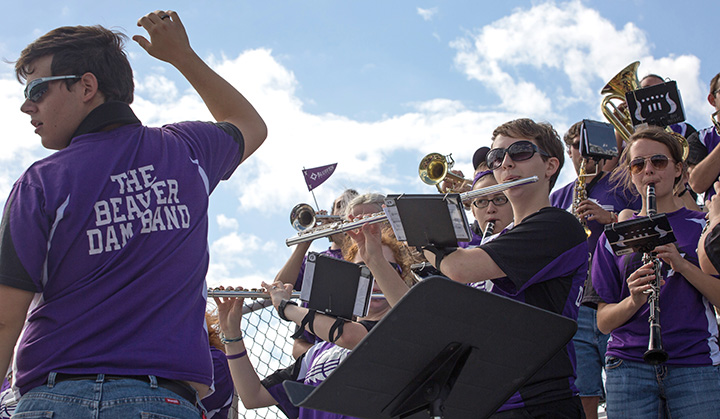 Bluffton University senior directs the pep band at a home football game