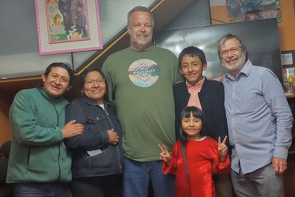 Greg Mott of the University of Findlay and Dr. Paul Neufeld Weaver of Bluffton University pose with their host family during the UF study trip to Peru,